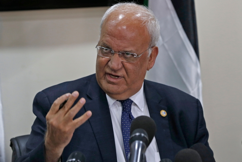 Saeb Erekat, Secretary General of the Palestine Liberation Organization (PLO) and chief Palestinian negotiator, speaks during a press conference in the Palestinian West Bank city of Ramallah on Tuesday. -AFP