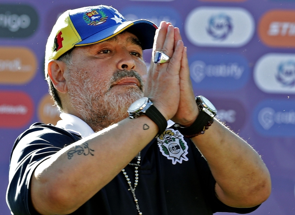 In this file photo taken on Nov. 02, 2019, Gimnasia team coach Diego Armando Maradona gestures to supporters as he leaves the field after an Argentina First Division Superliga football match against Estudiantes, at El Bosque stadium, in La Plata, Buenos Aires province, Argentina. Diego Maradona resigned on Tuesday, as coach of Argentina's first-division club Gimnasia y Esgrima La Plata, the president of the club, Gabriel Pellegrino, said. — AFP