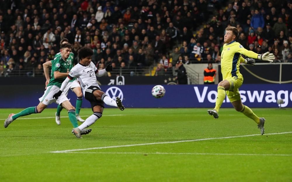 Germany's forward Serge Gnabry (2nd L) scores past Northern Ireland's goalkeeper Bailey Peacock-Farrell during the UEFA Euro 2020 Group C qualification football match Germany v Northern Ireland in Frankfurt am Main, western Germany on Tuesday. — AFP