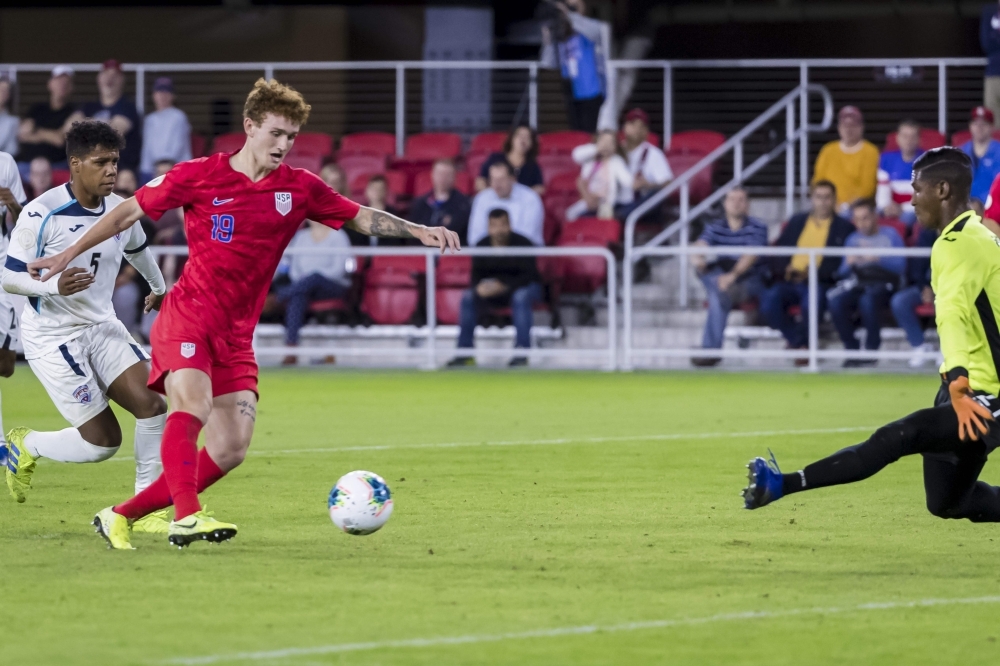 In this file photo taken on Oct. 11, 2019, Josh Sargent (19) of the United States shoots the ball against Nelson Johnston (21) of Cuba during the first half at Audi Field in Washington, DC. Jordan Morris and teenager Josh Sargent scored two goals apiece as the United States eased into the final four of the CONCACAF Nations League on Tuesday with a 4-0 win over Cuba. — AFP