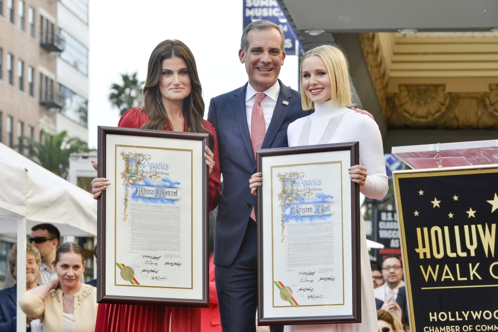 Idina Menzel, left, Mayor Eric Garcetti, center, and Kristen Bell, right, on The Hollywood Walk of Fame in Hollywood, California, in this Nov. 19, 2019 file photo. — AFP