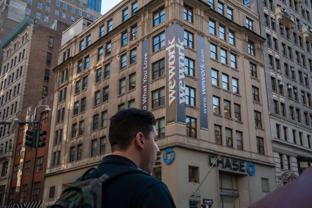 WeWork offices located at 349 5th Ave on Thursday in New York City. WeWork has laid off 2,400 employees as it works to cut costs in its attempts to right-size the business.— AFP