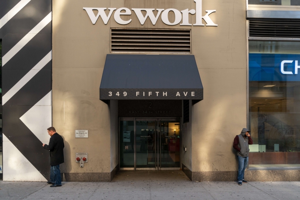WeWork offices located at 349 5th Ave on Thursday in New York City. WeWork has laid off 2,400 employees as it works to cut costs in its attempts to right-size the business.— AFP