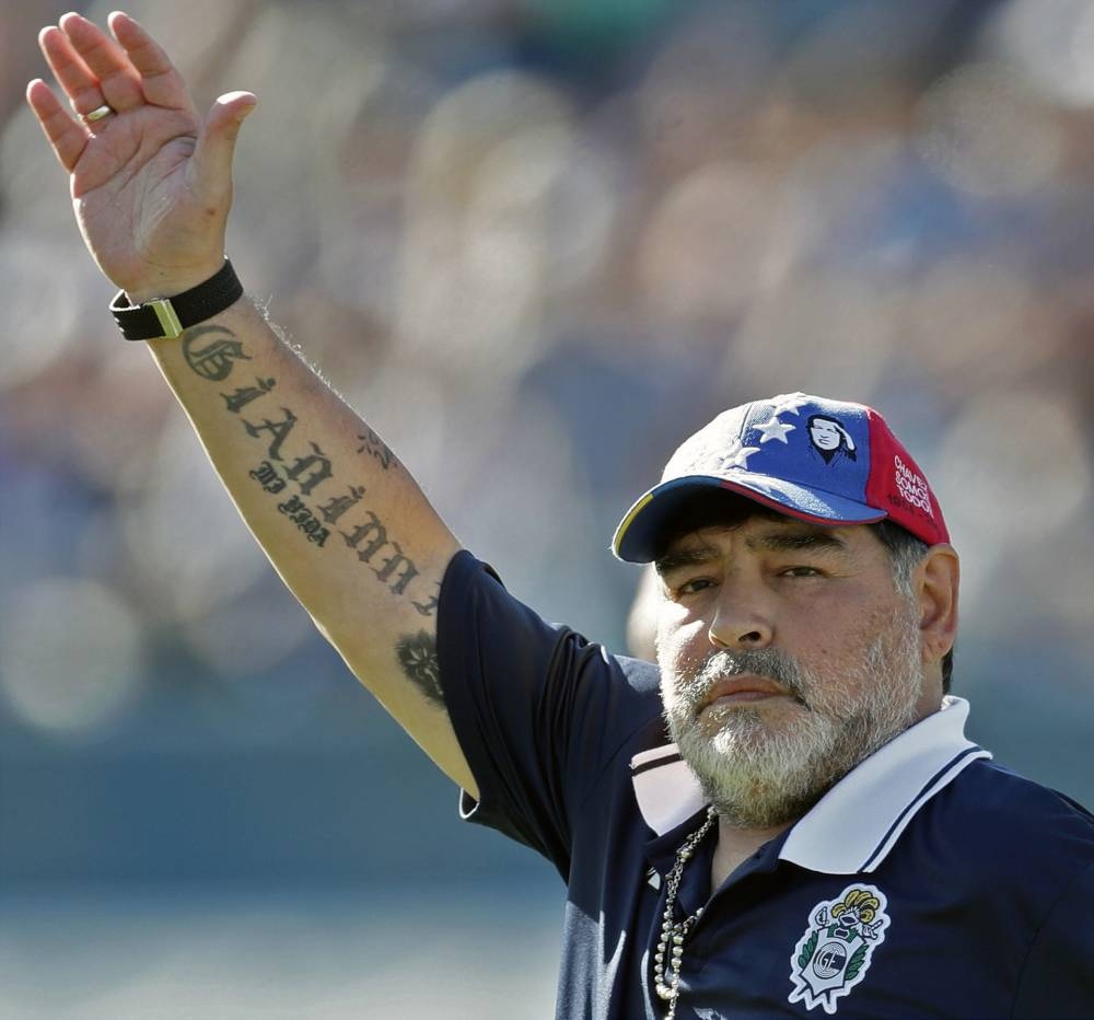 In this file photo taken on Nov. 2, 2019, Argentina's Gimnasia y Esgrima La Plata coach, former football star Diego Armando Maradona waves to supporters during an Argentina First Division Superliga football match against Estudiantes, at El Bosque stadium, in La Plata, Buenos Aires province, Argentina. — AFP