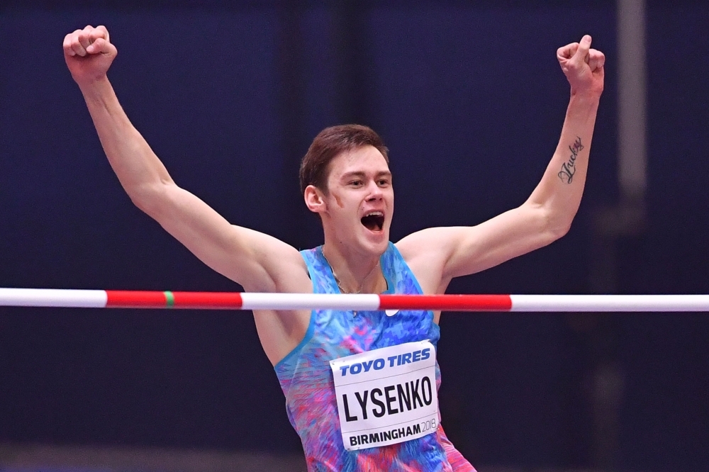 This file photo taken on March 1, 2018 shows Authorized Neutral Athlete Danil Lysenko celebrating after the winning clearence in the men's high jump final at the 2018 IAAF World Indoor Athletics Championships at the Arena in Birmingham. The Athletics Integrity Unit (AIU) on Thursday charged the Russian athletics federation (RUSAF) with 