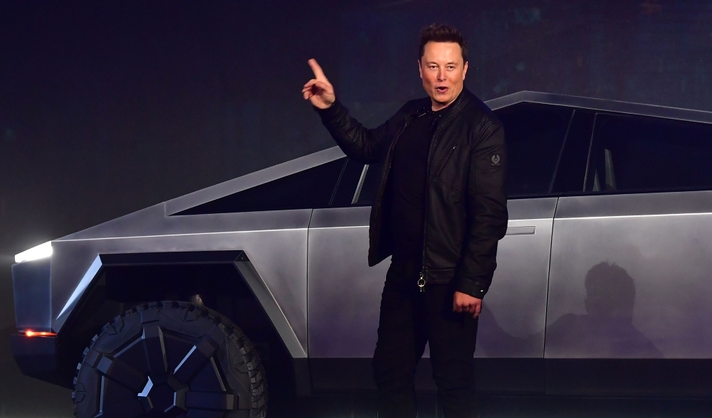 Tesla co-founder and CEO Elon Musk gestures while wrapping up his presentation of the newly unveiled all-electric battery-powered Tesla Cybertruck at Tesla Design Center in Hawthorne, California, on Thursday. — AFP