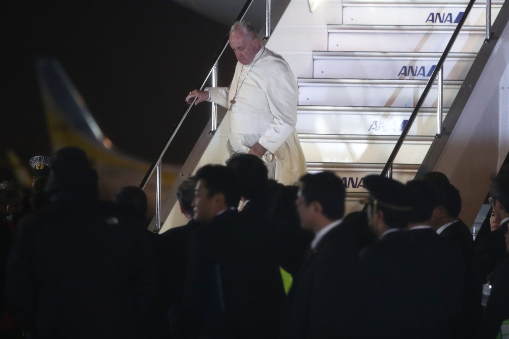 Japanese greeters clad in traditional attire are seen during Pope Francis' arrival in Tokyo's Haneda airport on Saturday. -AFP