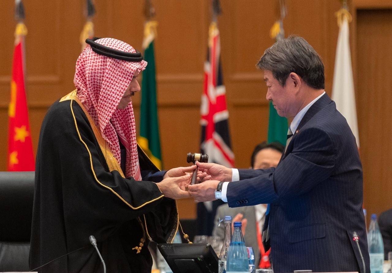 Foreign Minister Prince Faisal Bin Farhan receives the G20 baton from Japanese Foreign Minister Toshimitsu Motegi at a ceremony on Saturday in Nagoya.