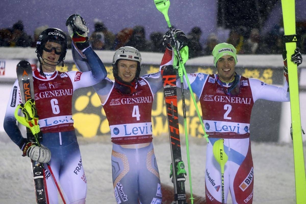 Norway's Henrik Kristoffersen, center, winner of an alpine ski, men's slalom, poses with second placed France Clement Noel, left, and third place Switzerland's Daniel Yule, in Levi, Finland, on Sunday. — Courtesy photo