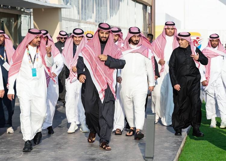 Crown Prince Muhammad Bin Salman, deputy premier and minister of defense, takes time out to inspect a classic car on show at the the Riyadh Motor Show in Janadriyah on Monday.— Photos by Bandar Algaloud
