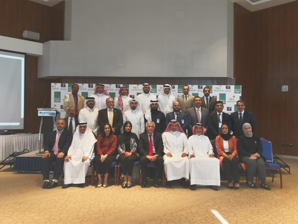 Participants in the meeting pose for a group photo