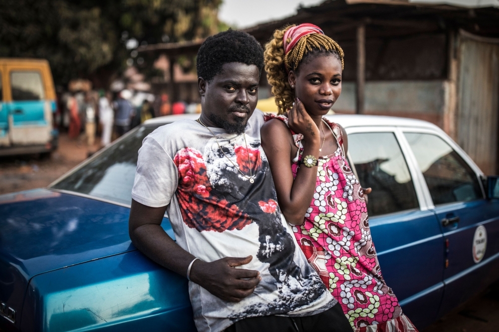 Geronimo and Joana, a young couple, stand outside a polling station after they voted in the popular Bairro Militar area of the capital Bissau, in Guinea-Bissau, in this Nov. 24, 2019 file photo. — AFP