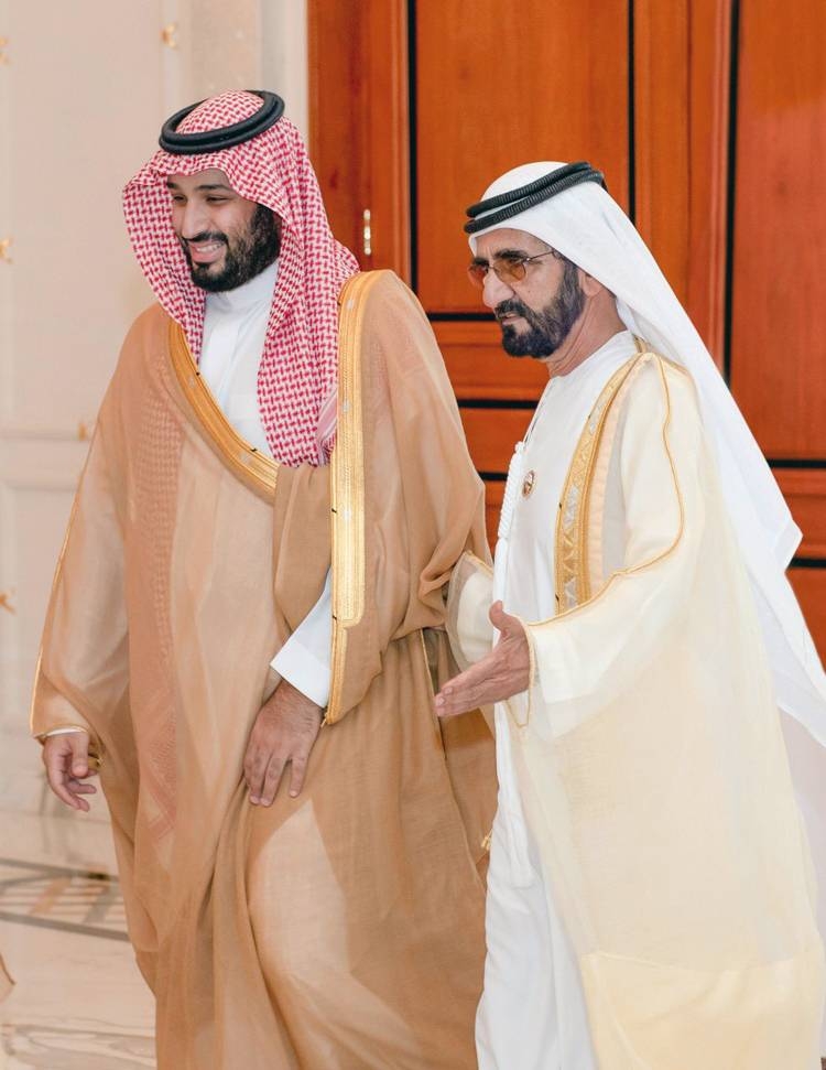 Crown Prince Muhammad Bin Salman, deputy premier and minister of defense, and UAE Vice President and Prime Minister and Dubai Ruler Sheikh Mohammed Bin Rashid are greeted by officials at the Zabeel Palace on Thursday.