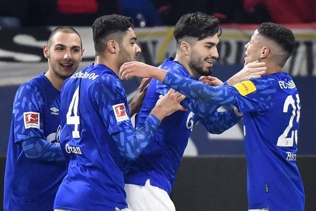 Schalke's Suat Serdar, 2nd from right, celebrates his goal with Schalke's Amine Harit, right, during the German Bundesliga soccer match between FC Schalke 04 and Union Berlin in Gelsenkirchen, Germany, Friday. — Courtesy photo
