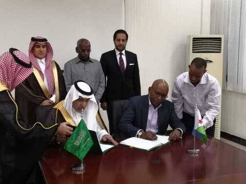 Vice Chairman of the Saudi Fund for Development Dr. Khalid Bin Sulaiman Al Khudairy (left) and the Djibouti Minister of Economy and Finance Elias Moussa Doula sign a new grant agreement in the presence of Prime Minister of Djibouti Mr. Abdoulkader Kamil Mohamed (center back row). — Courtesy photo