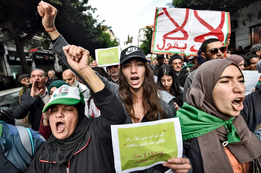 Algerians chant slogans as they march during an anti-government demonstration in the Algerian capital Algiers in this Dec. 3, 2019 file photo. — AFP