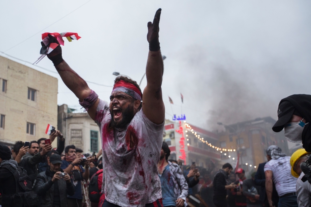 Iraqi actors perform a play representing the ongoing anti-government demonstrations, in Tahrir Square in the capital Baghdad, , in this Dec. 3, 2019 file photo. — AFP