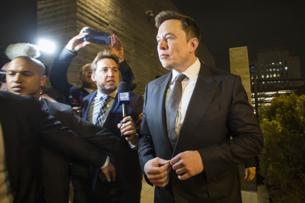 Elon Musk, chief executive officer of Tesla Inc. leaves the US District Court, Central District of California through a back door in Los Angeles, California, in this Dec. 3, 2019. — AFP