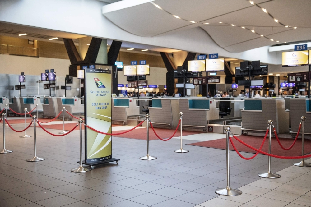 Empty SAA (South African Airways) check-in counters are seen at the O.R. Tambo International Airport in Johannesburg, South Africa, in this November 15, 2019 file photo. — AFP