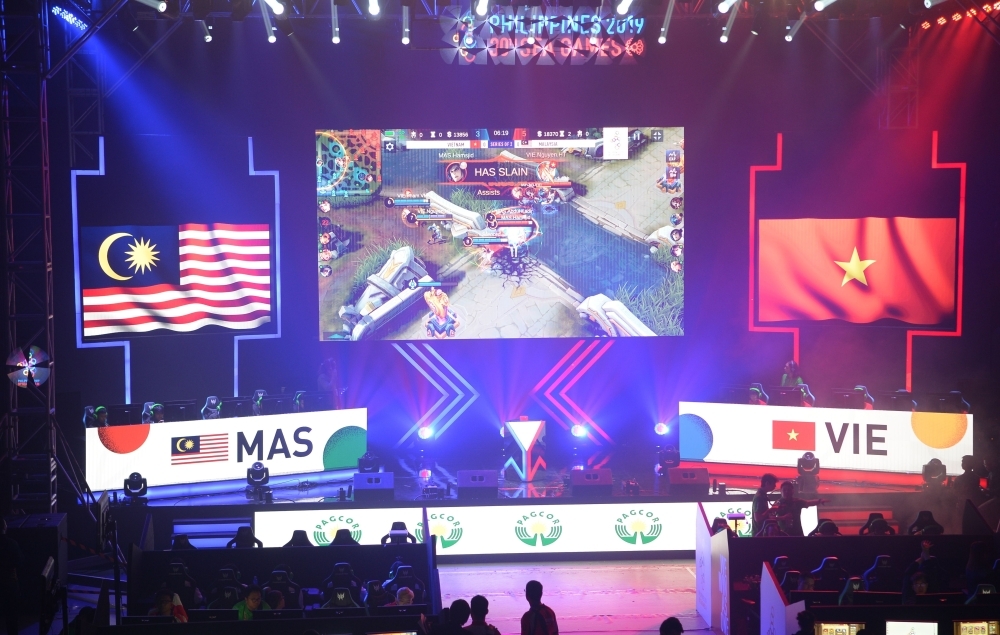 Gamers from the Vietnam team compete in the qualifying rounds of the eSports event between Malaysia and Vietnam at the SEA Games (Southeast Asian Games) in Manila on Thursday. — AFP