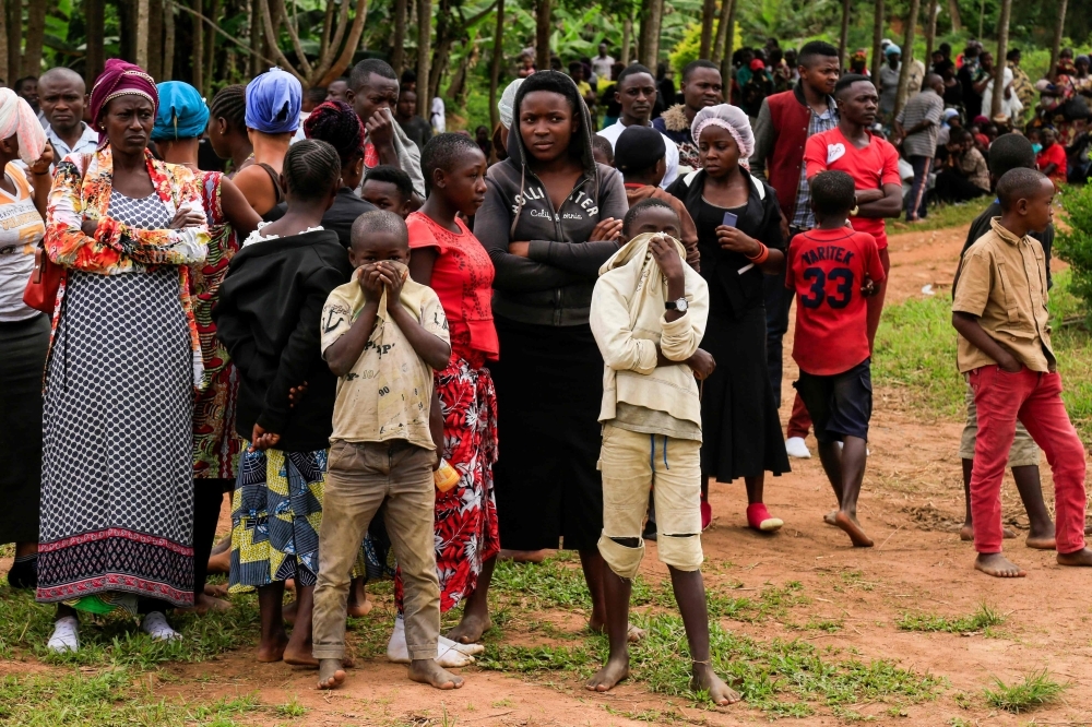 People gather in Oicha, D.R. Congo, as 27 victims of the latest massacre in the country's volatile east get buried in this Nov. 29, 2019 file photo. — AFP