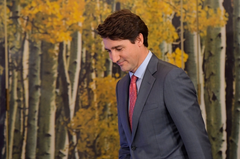 Canada's Prime Minister Justin Trudeau gives a press conference in the media center at the NATO summit at the Grove hotel in Watford, northeast of London, on Wednesday. — AFP