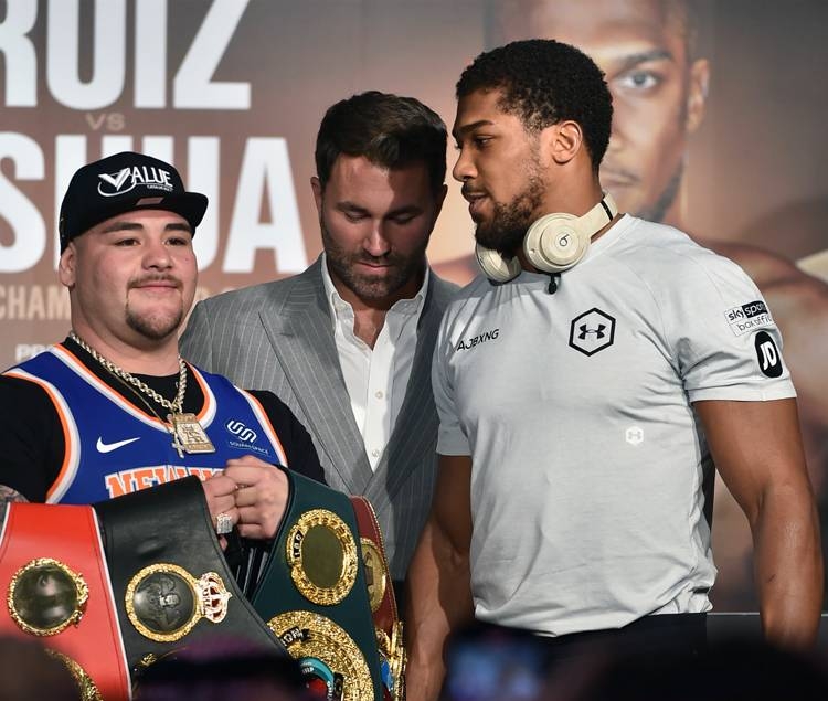 Mexican-American heavyweight boxing champion Andy Ruiz Jr (L) Eddie Hearn (C) and British heavyweight boxing challenger Anthony Joshua (R) are pictured during their press conference in Diriyah in the Saudi capital Riyadh, on Wednesday, ahead of the upcoming 
