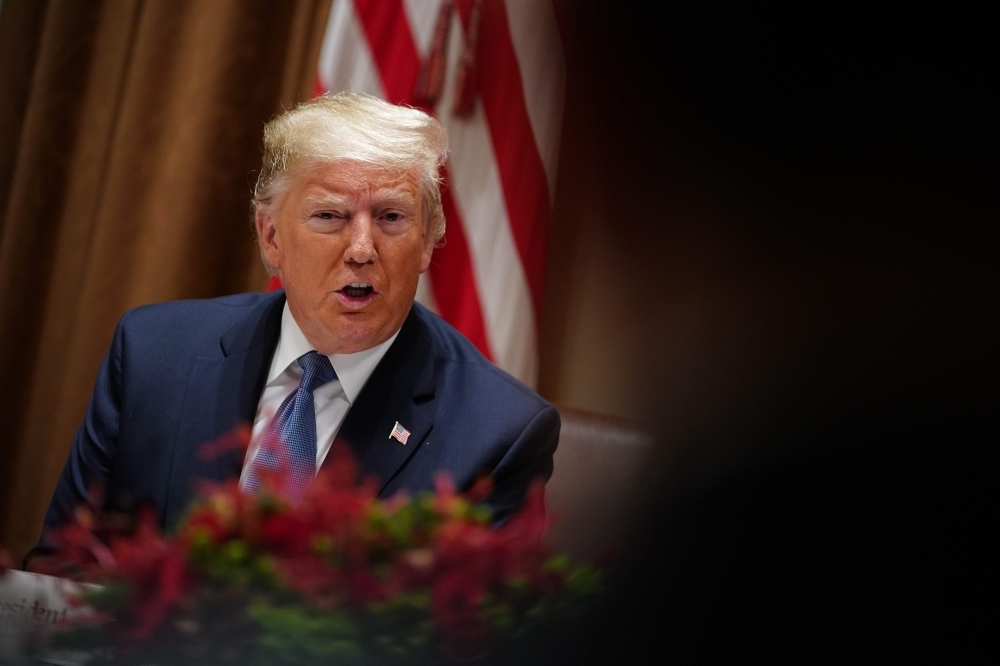 US President Donald Trump takes part in a luncheon with the UN Security Council permanent representatives in the Cabinet Room of the White House in Washington, DC, on Dec.5, 2019. — AFP