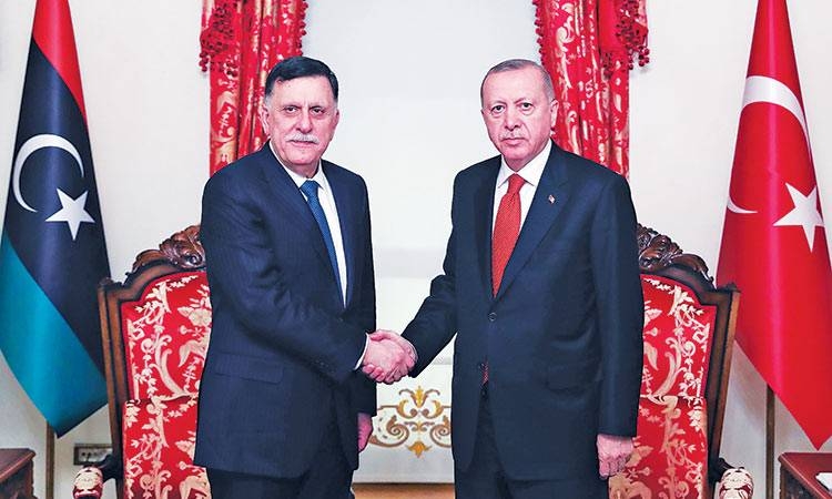 Recep Tayyip Erdogan, right, greets Fayez Al-Sarraj in Istanbul in this Nov. 28, 2019 file photo. — AFP