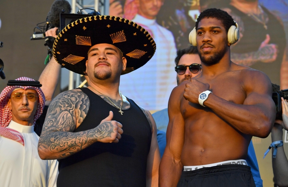 Mexican-American heavyweight boxing champion Andy Ruiz Jr (L) and British heavyweight boxing challenger Anthony Joshua pose during the official weigh-in at Diriyah in the Saudi capital Riyadh, on Friday, ahead of the upcoming 