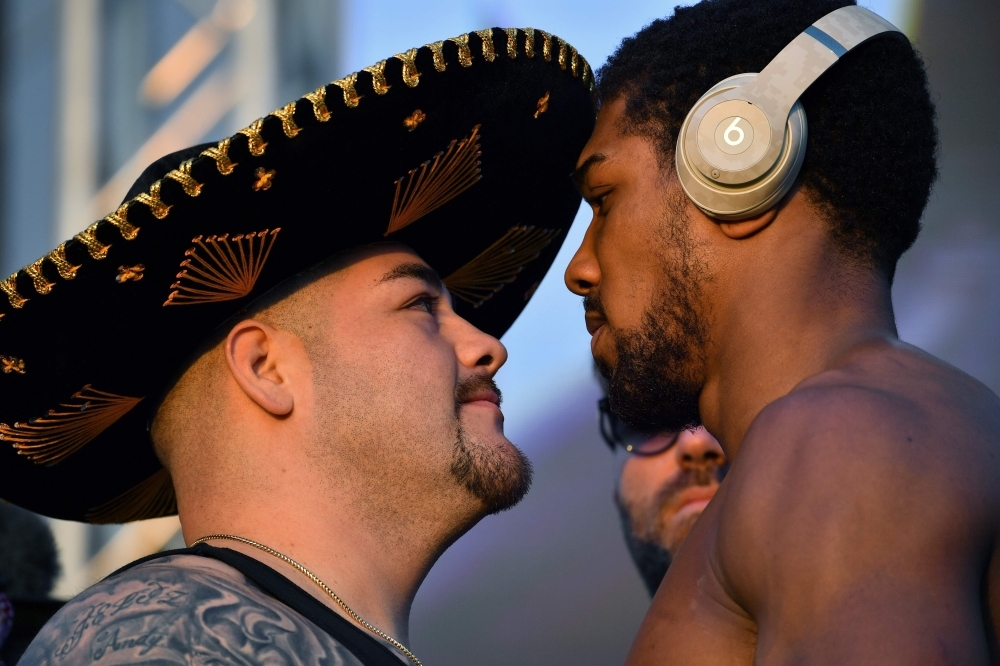 Mexican-American heavyweight boxing champion Andy Ruiz Jr (L) and British heavyweight boxing challenger Anthony Joshua pose during the official weigh-in at Diriyah in the Saudi capital Riyadh, on Friday, ahead of the upcoming 