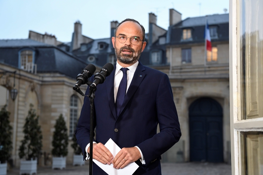 French Prime Minister Edouard Philippe gives a press conference during a general strike over French government's plan to overhaul the country's retirement system, at the Matignon palace in Paris, on Friday. — AFP