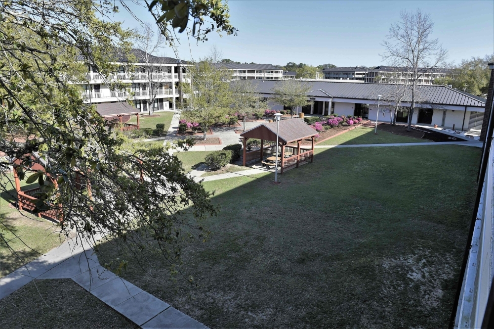 This March 7, 2018, image obtained from the US Navy shows a courtyard and barracks at Naval Air Station Pensacola in Florida. — AFP