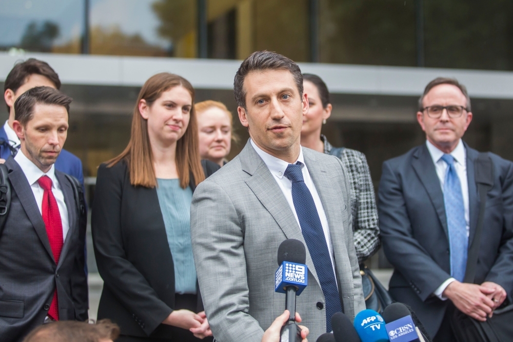 Alex Spiro, leader of Elon Musk attorneys team, talks to the press as he leaves the US District Court, Central District of California in Los Angeles on Friday. -AFP