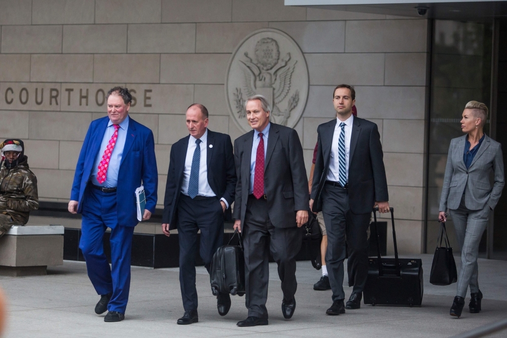 Alex Spiro, leader of Elon Musk attorneys team, talks to the press as he leaves the US District Court, Central District of California in Los Angeles on Friday. -AFP