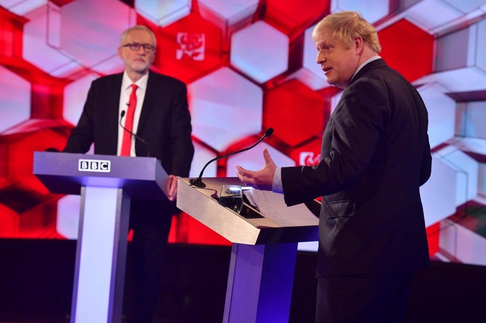  Britain's Prime Minister Boris Johnson (R) and Britain's main opposition Labour Party leader Jeremy Corbyn participate in the BBC Prime Ministerial leaders debate, at the studio in Maidstone, Kent on Friday. -AFP
