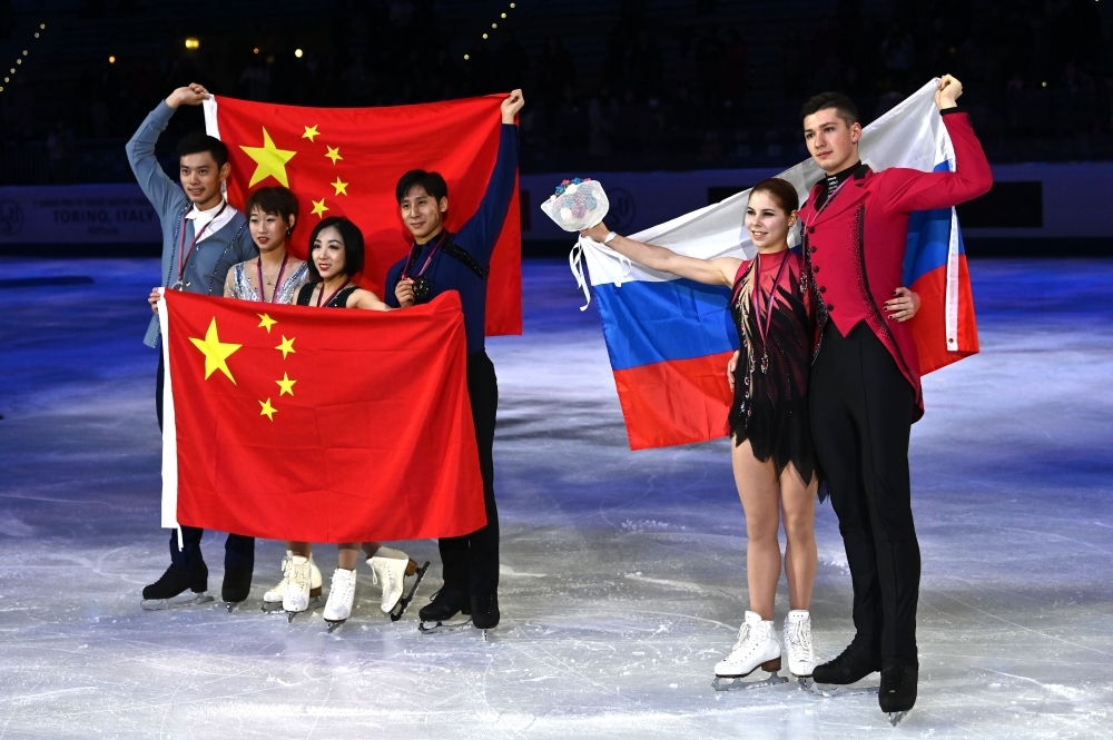 Winners China's Wenjing Sui and Cong Han pose with gold medals after the Pairs Free Skating program at the ISU Grand Prix of figure skating Final 2019 in Turin, on Friday. — AFP