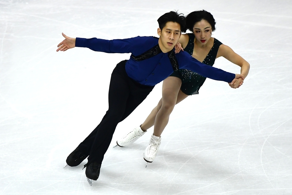 Winners China's Wenjing Sui and Cong Han pose with gold medals after the Pairs Free Skating program at the ISU Grand Prix of figure skating Final 2019 in Turin, on Friday. — AFP