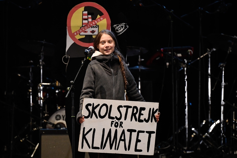  Swedish climate activist Greta Thunberg delivers a speech after a mass climate march to demand urgent action on the climate crisis from world leaders attending the COP25 summit, in Madrid, on Friday. -AFP