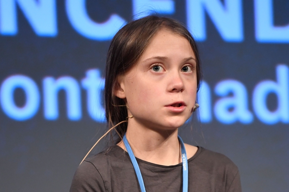  Swedish climate activist Greta Thunberg delivers a speech after a mass climate march to demand urgent action on the climate crisis from world leaders attending the COP25 summit, in Madrid, on Friday. -AFP