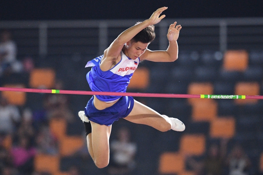 Kristina Marie Knott from the Philippines celebrates after winning in the women's 200m athletics event at the SEA Games (Southeast Asian Games) at the athletics stadium in Clark, Capas, Tarlac province north of Manila, on Saturday. — AFP