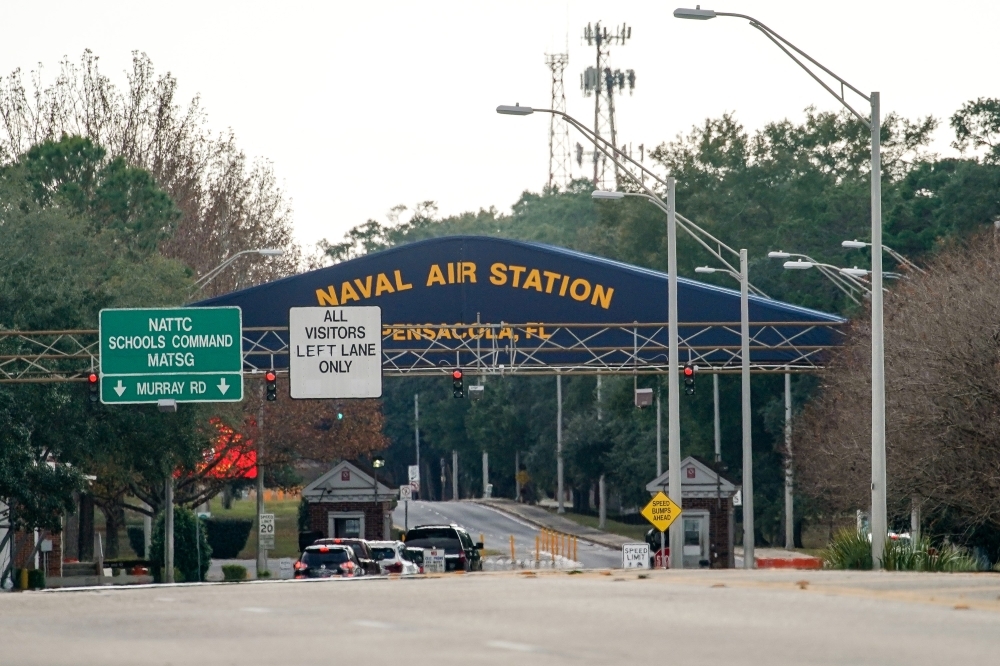 A general view of the atmosphere at the Pensacola Naval Air Station main gate following a shooting on Friday in Pensacola, Florida. The second shooting on a US Naval Base in a week has left three dead plus the suspect and seven people wounded. — AFP
