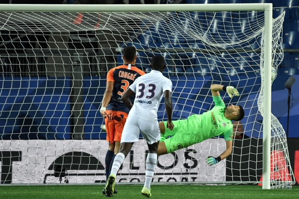 Paris Saint-Germain's Brazilian forward Neymar fights for the ball with Montpellier's Portuguese defender Pedro Mendes (R) during the French L1 football match between Montpellier Herault Sport Club (MHSC) and Paris Saint-Germain (PSG) at the Mosson stadium in Montpellier, southeastern France, on Saturday. — AFP