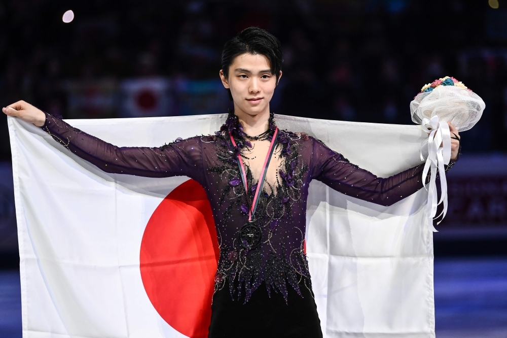 Winner USA's Nathan Chen poses with his medal and the US flag after the Men Free Skating program at the ISU Grand Prix of figure skating Final 2019 in Turin, on Saturday. — AFP