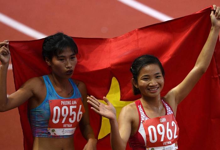 Duong Van Thai of Vietnam celebrates after winning in the men's 1,500m athletics event at the SEA Games (Southeast Asian Games) in the athletics stadium in Clark City, Capas, Tarlac province north of Manila, on Sunday. — AFP