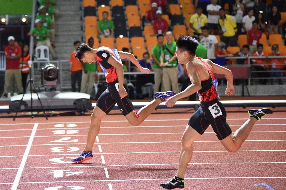 Duong Van Thai of Vietnam celebrates after winning in the men's 1,500m athletics event at the SEA Games (Southeast Asian Games) in the athletics stadium in Clark City, Capas, Tarlac province north of Manila, on Sunday. — AFP