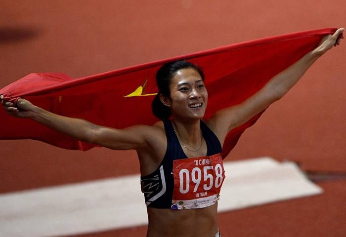 Duong Van Thai of Vietnam celebrates after winning in the men's 1,500m athletics event at the SEA Games (Southeast Asian Games) in the athletics stadium in Clark City, Capas, Tarlac province north of Manila, on Sunday. — AFP