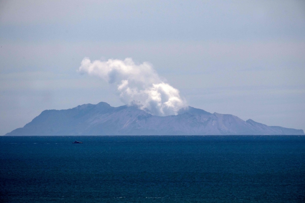Steam rises from the White Island volcano following the Dec. 9 volcanic eruption, in Whakatane, New Zealand, on Wednesday. — AFP