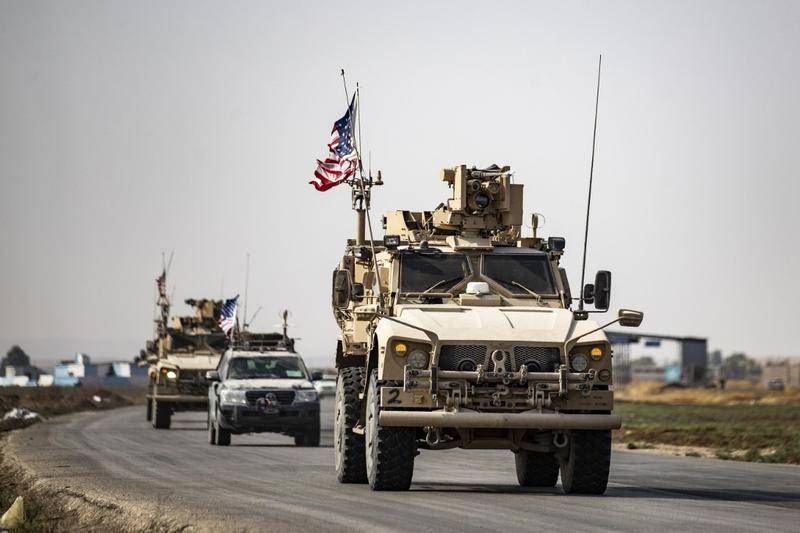 US military vehicles drive on a road toward Iraq after US forces pulled out of their Tal Tamr base in Northern Syrian in this Oct. 20, 2019 file photo. — AFP