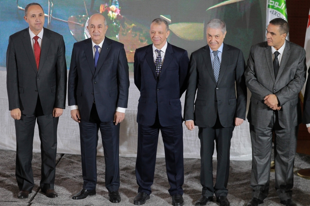 Algerian presidential candidates Former Culture Minister Azzedine Mihoubi, left, former Prime Minister Abdelmadjid Tebboune, second left, former Tourism Minister Abdelkader Bengrina, center, former Prime Minister Ali Benflis, second right, and the head of the Mostakbal Movement party, Abdelaziz Belaid, right, stand together during a press conference after signing a charter of ethics in the capital Algiers in this Nov. 16, 2019 file photo. — AFP